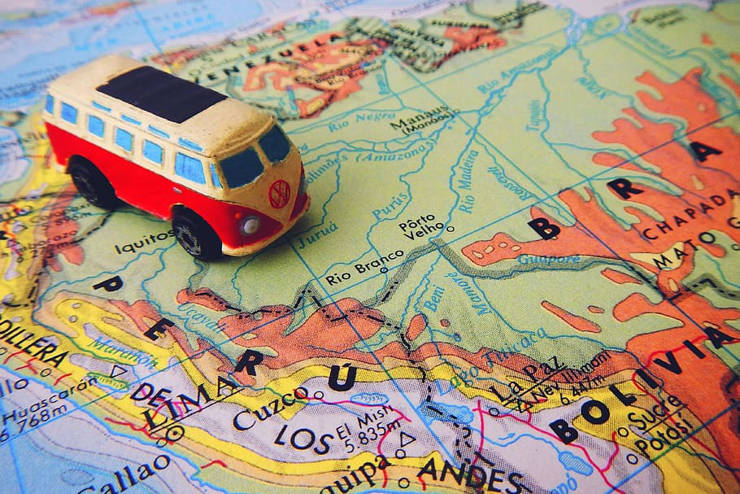 Image of a toy VW van sitting on a map of South America